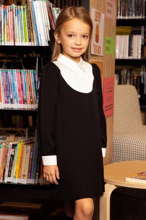 Black dress with white collar and pleated detail