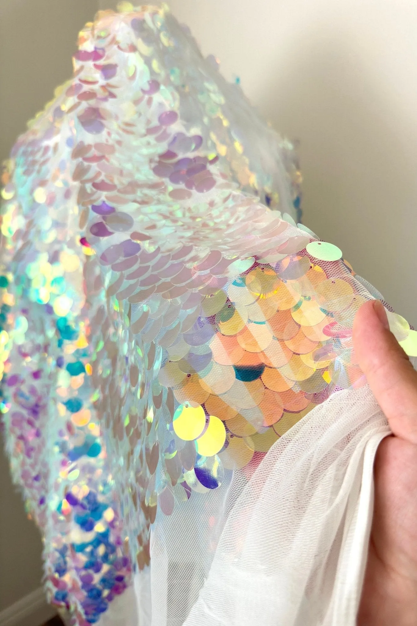 Iridescent Coin Sequin on White Mesh Fabric