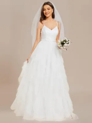 Robe de mariée en tulle scintillante à col en V et bretelles spaghetti