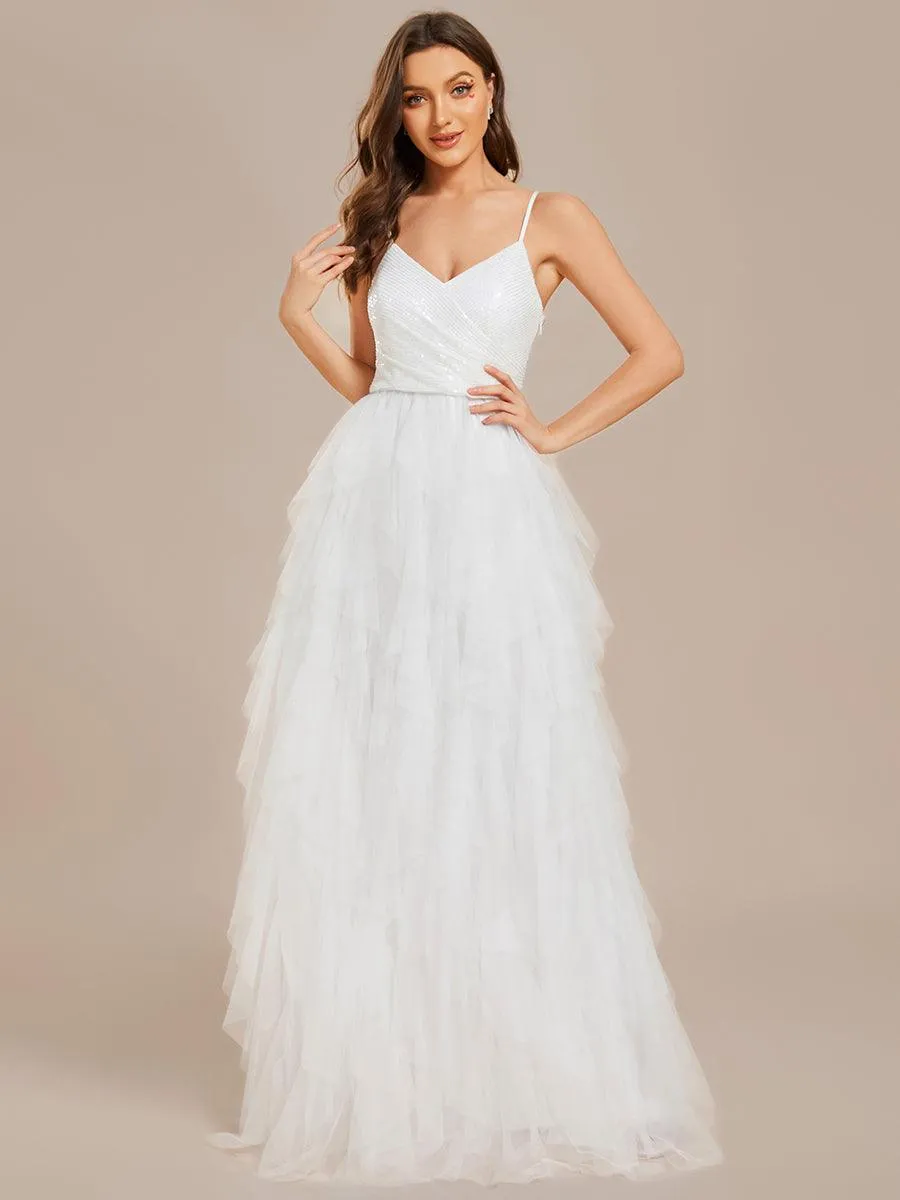 Robe de mariée en tulle scintillante à col en V et bretelles spaghetti