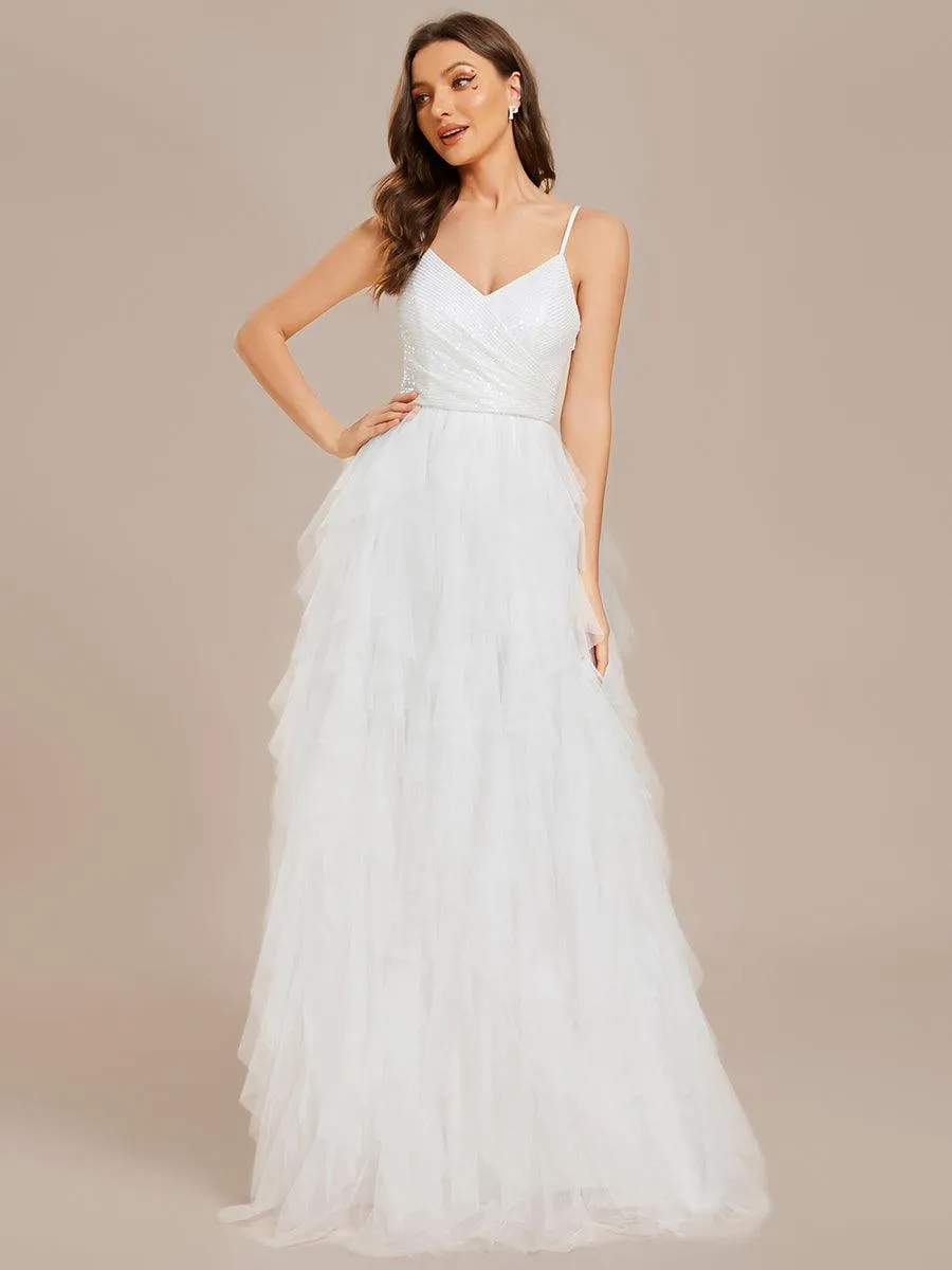 Robe de mariée en tulle scintillante à col en V et bretelles spaghetti