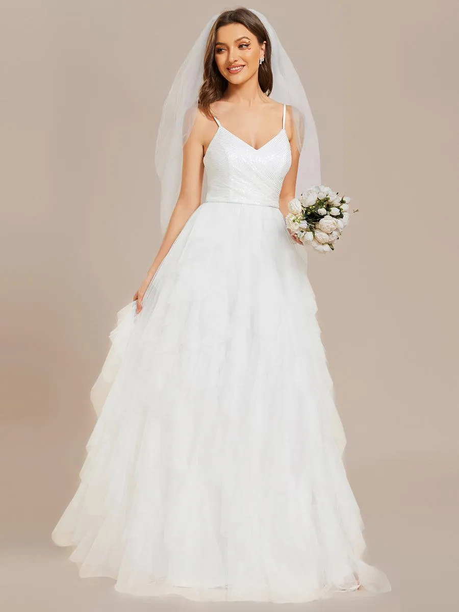 Robe de mariée en tulle scintillante à col en V et bretelles spaghetti