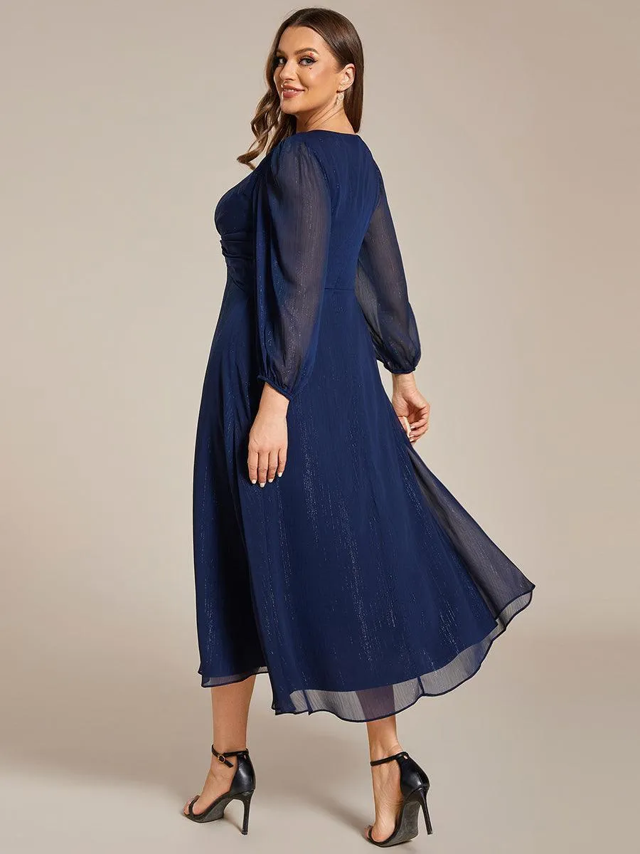 Robe d'invité trapèze en mousseline scintillante à manches longues et col en V