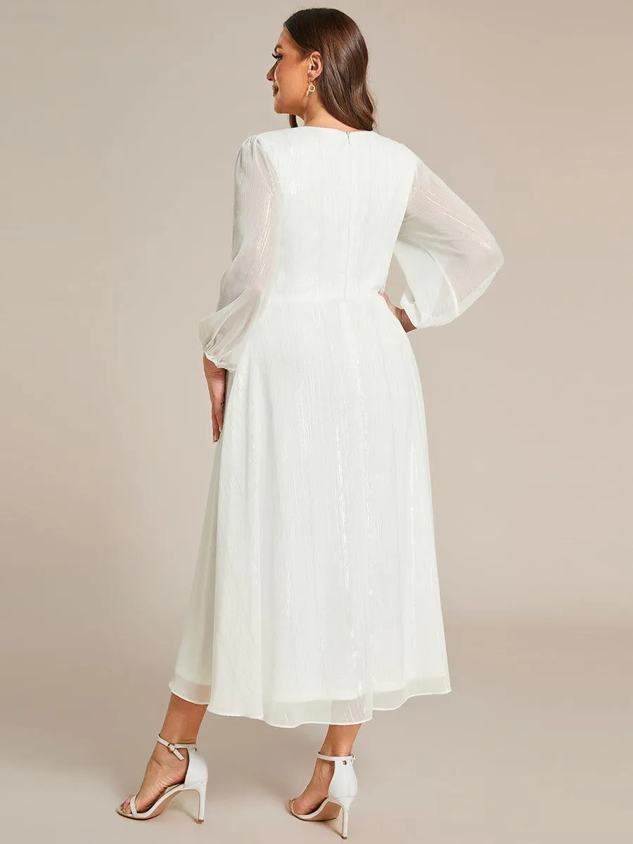 Robe d'invité trapèze en mousseline scintillante à manches longues et col en V