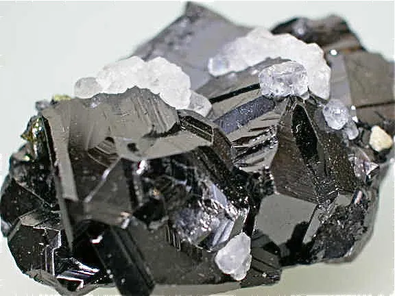 SOLD Calcite on Sphalerite, Trepca Complex, Municipality Kosovska, Kosovo, Mined 2010-2012, Minaiture 1.8 x 2.7 x .4.0 cm, $25.  Online 7/02