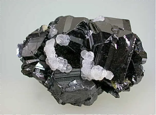 SOLD Calcite on Sphalerite, Trepca Complex, Municipality Kosovska, Kosovo, Mined 2010-2012, Minaiture 1.8 x 2.7 x .4.0 cm, $25.  Online 7/02
